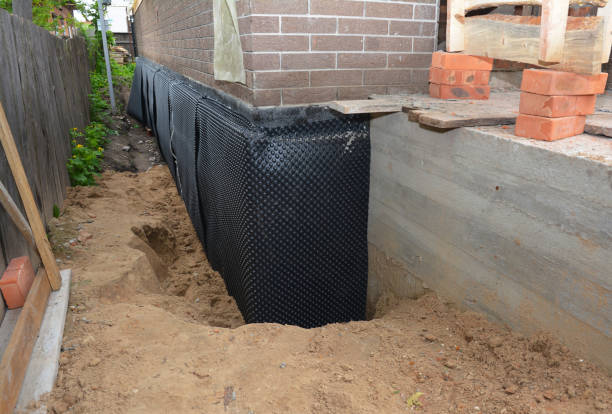 Happy homeowners after waterproofing job in Dumfries